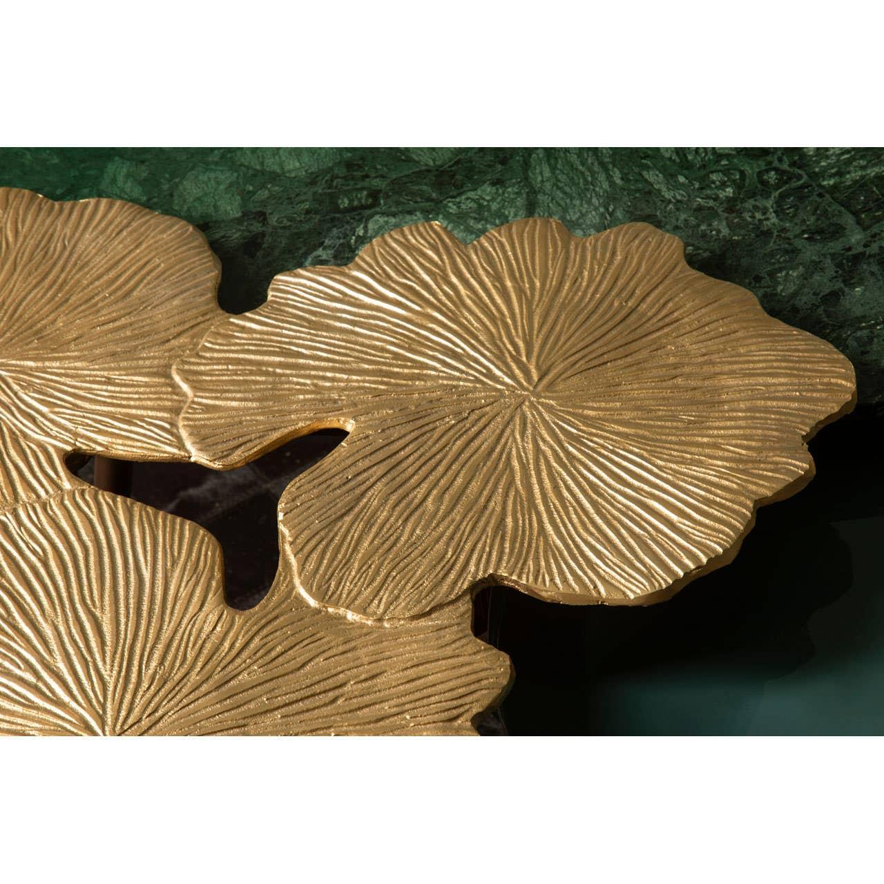 Gold metal lotus leaf detail on green marble coffee table top