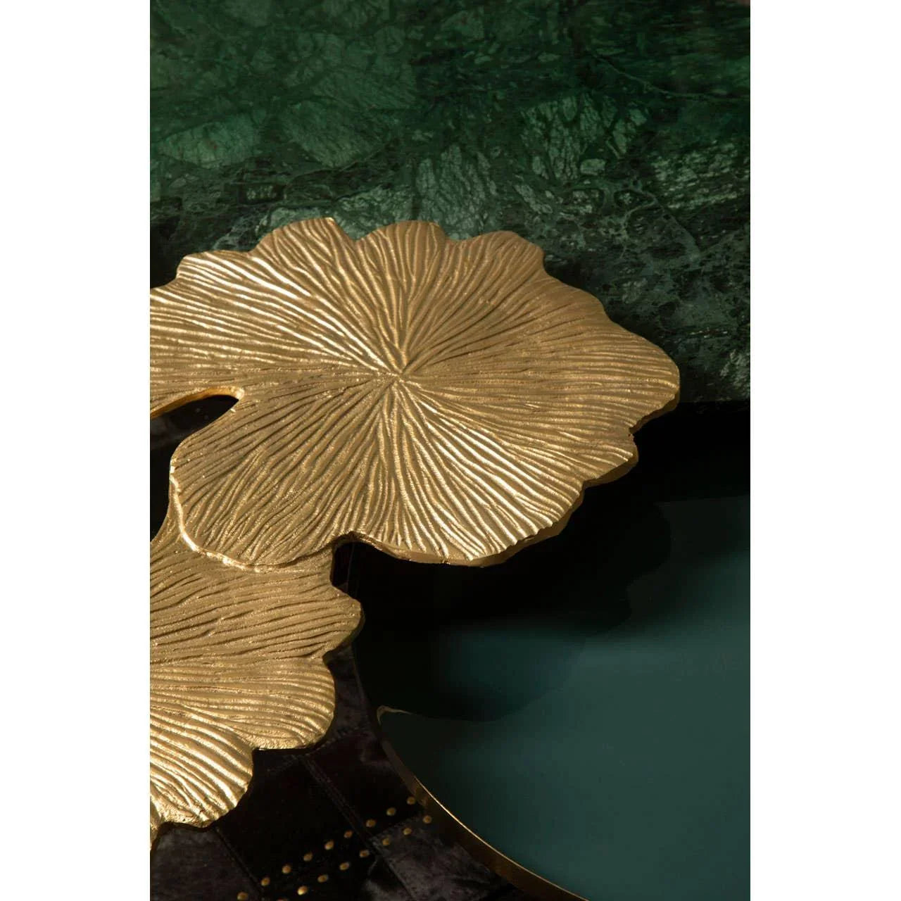 Gold metal leaf detail and green marble tabletop on designer coffee table