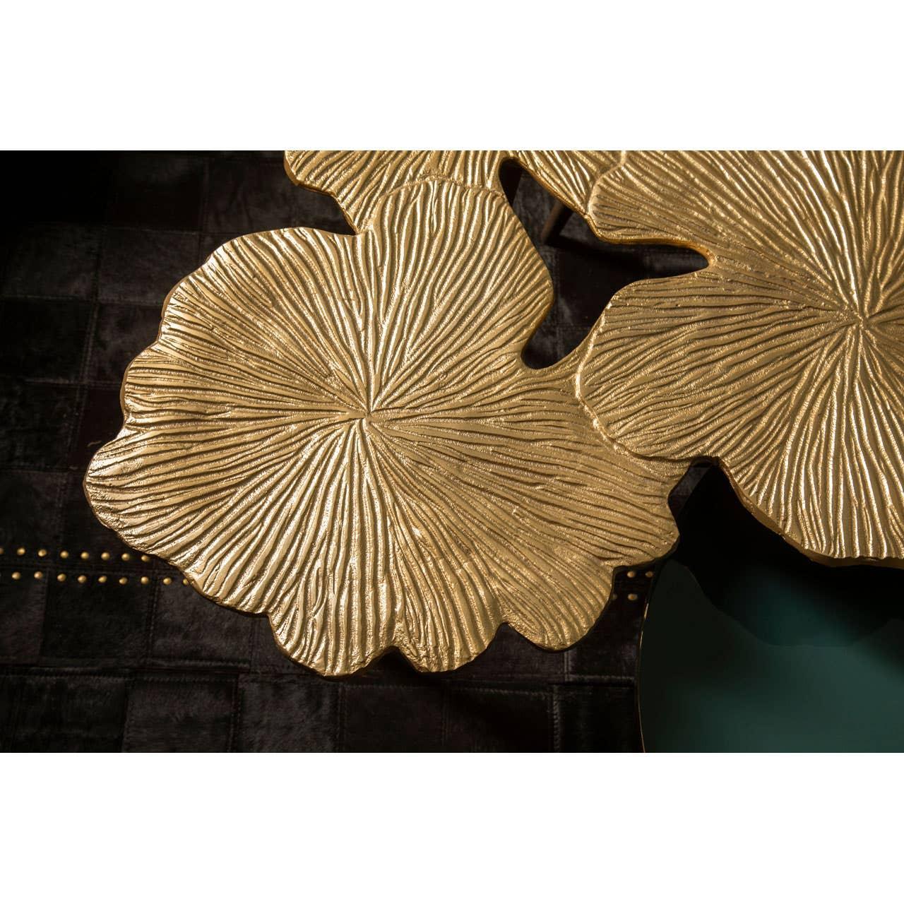 Textured gold metal coffee table top with leaf design detail