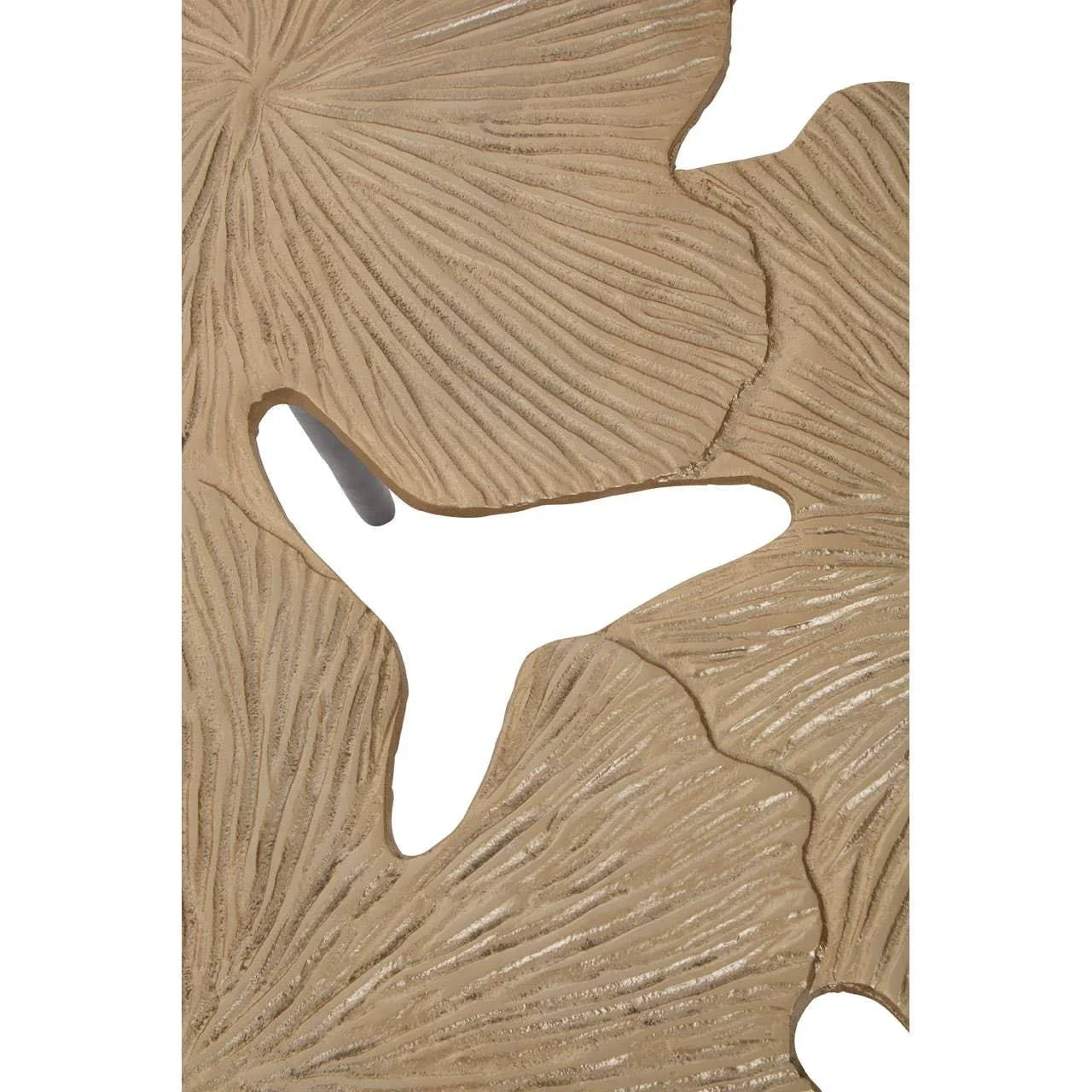 Gold metal side table with textured leaf pattern detail shown in close-up