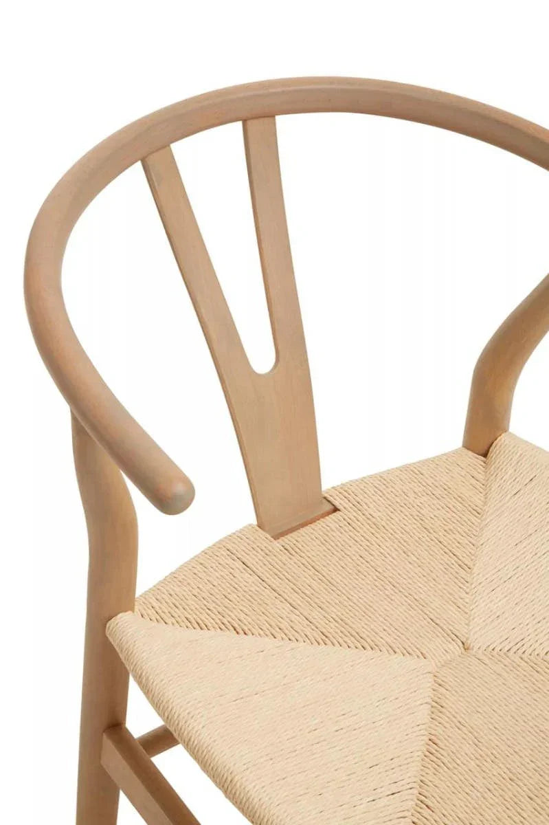 Curved wood dining chair with natural woven seat and light timber finish
