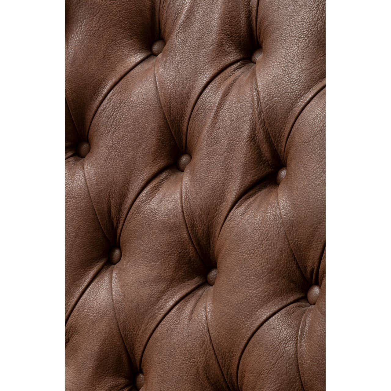 Close-up of the tufted brown leather effect upholstery on a chair, showcasing the rich texture and detailed stitching, with a soft, inviting appearance.