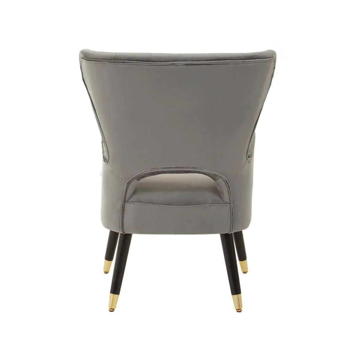 Grey velvet accent chair with gold-tipped black legs shown from the back