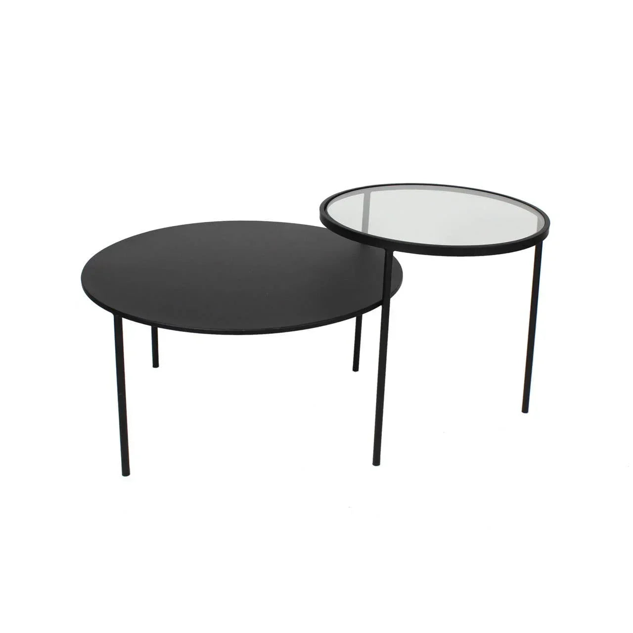 Black metal nesting coffee tables with round tops, one solid and one clear glass
