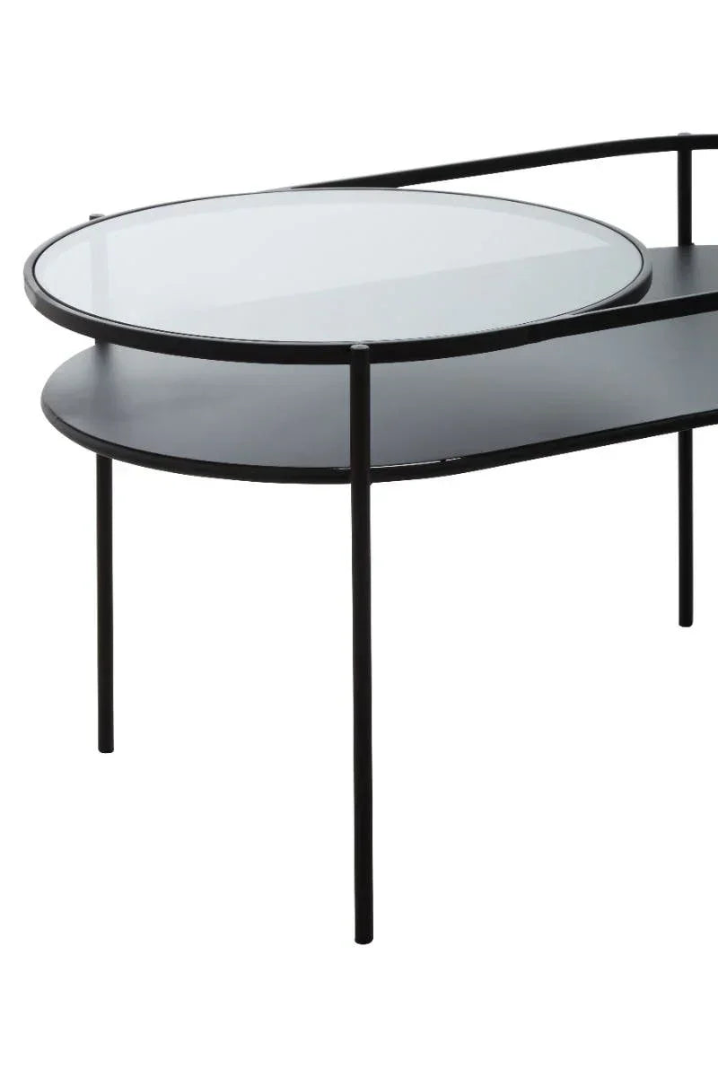 Black metal coffee table with round glass top and lower storage shelf