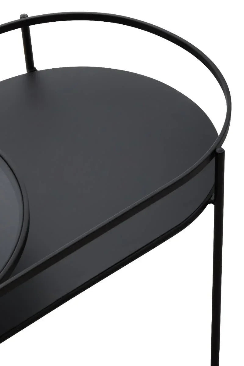 Black metal side table with raised edge and circular frame, close-up of table surface