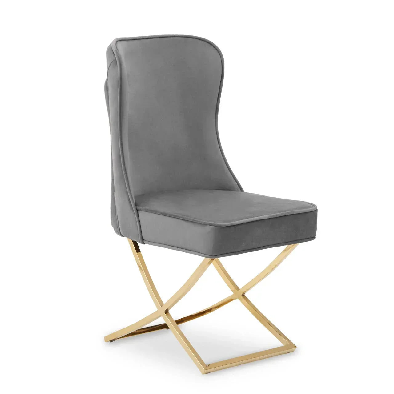 Grey velvet dining chair with high back and gold metal legs, side angle view