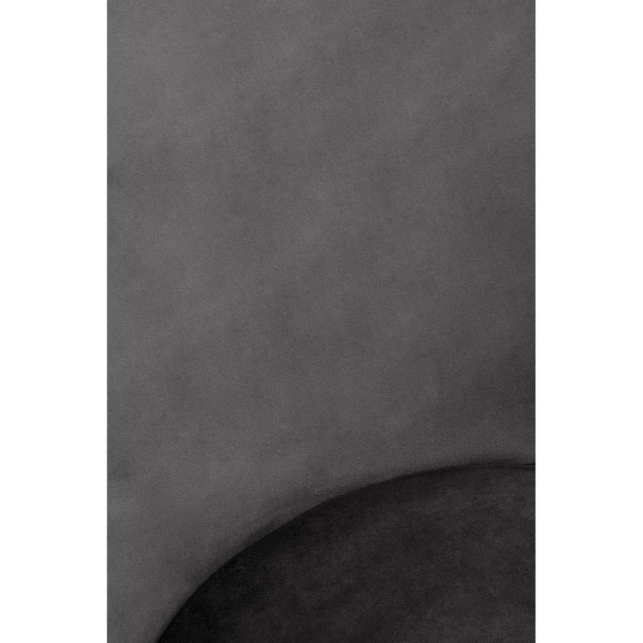 Closeup of dark grey velvet sofa upholstery fabric and curved cushion detail