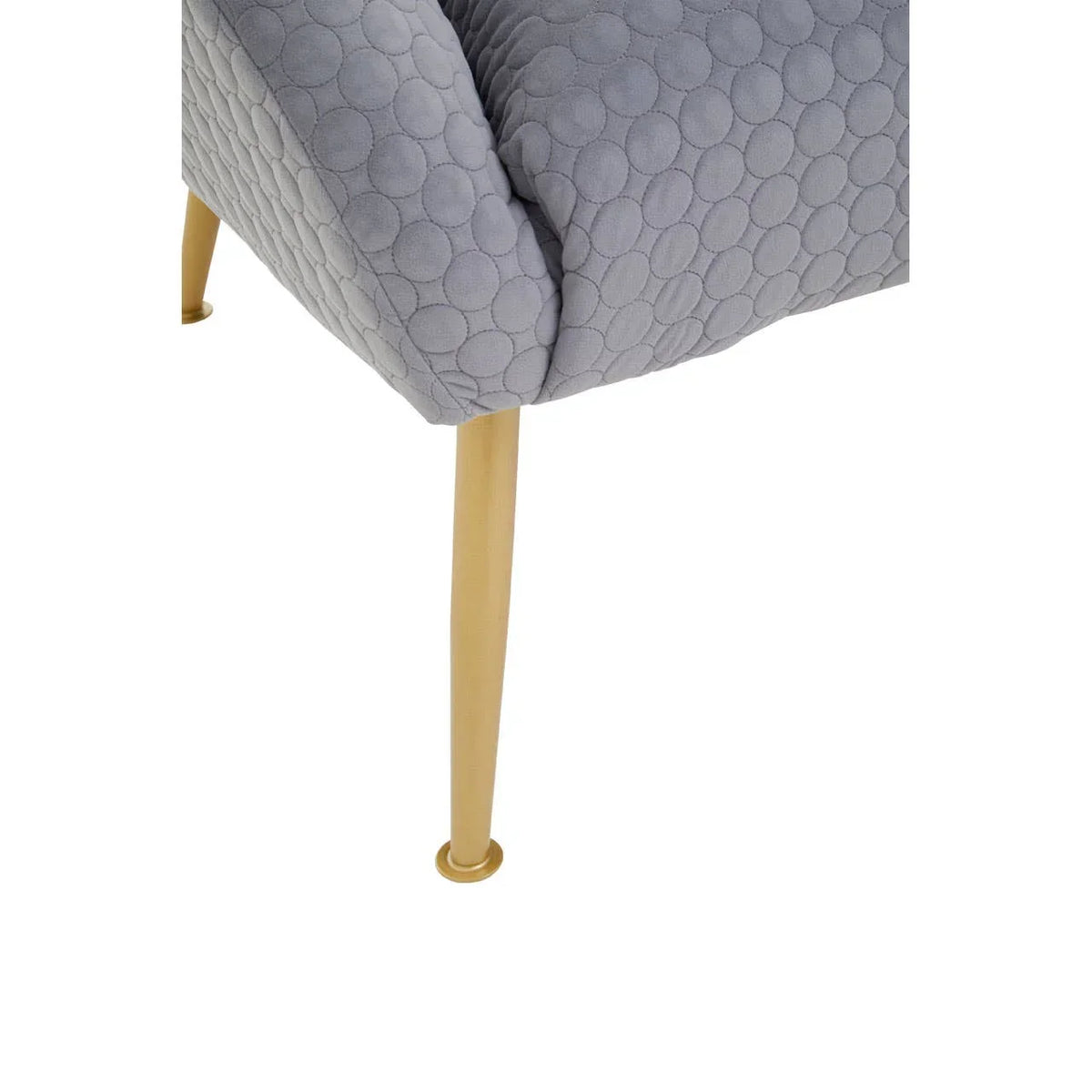Grey upholstered chair with textured fabric and gold metal leg close-up