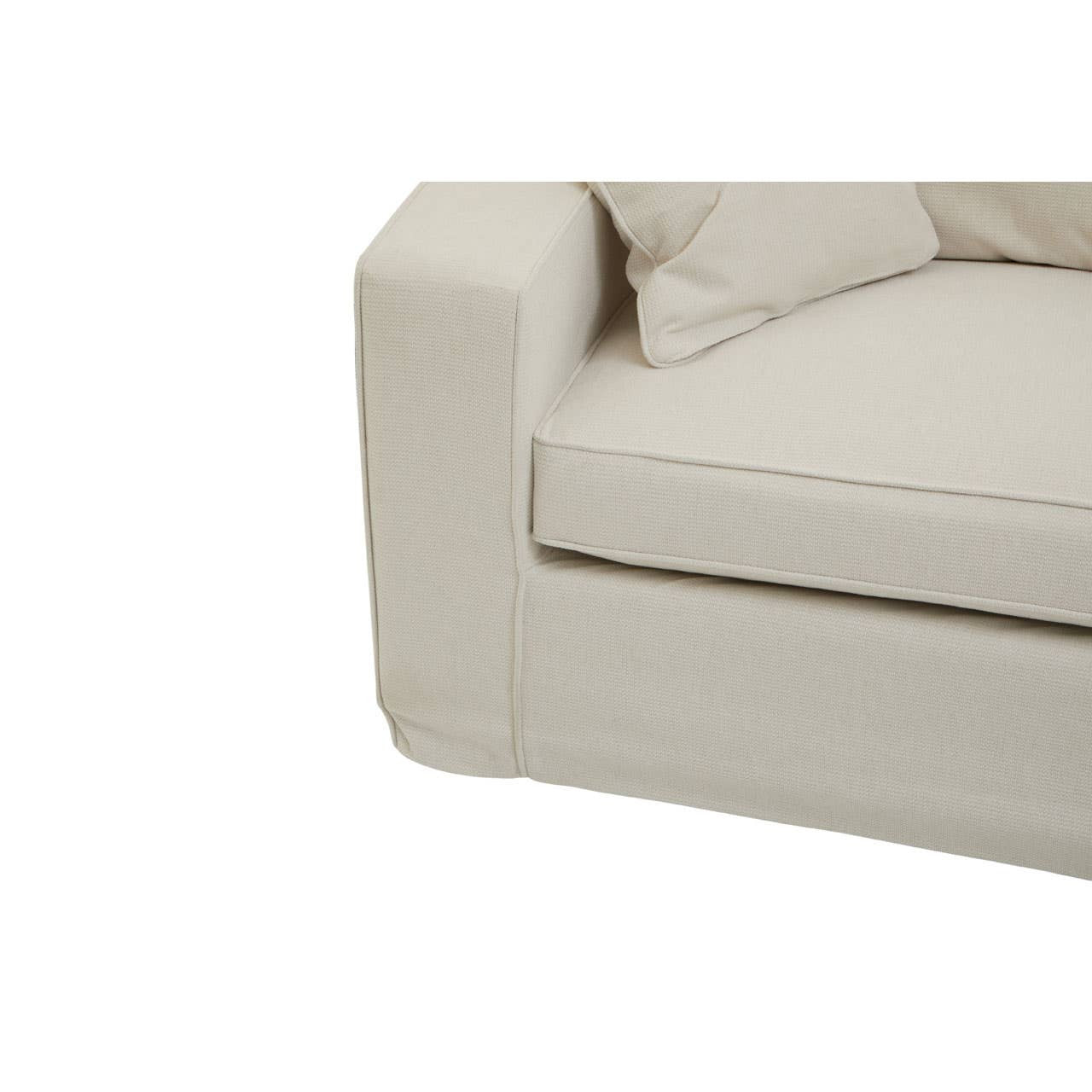 Cream fabric sofa with a modern design, featuring a low-profile armrest and plush cushions. The seat cushion is slightly recessed, and the overall look is minimalist and inviting, suitable for contemporary home decor