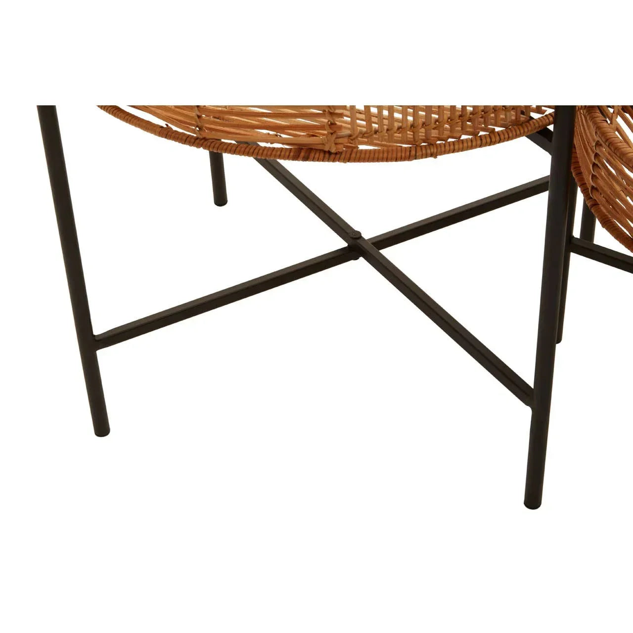 Closeup of rattan chair with black metal legs and crossbar frame