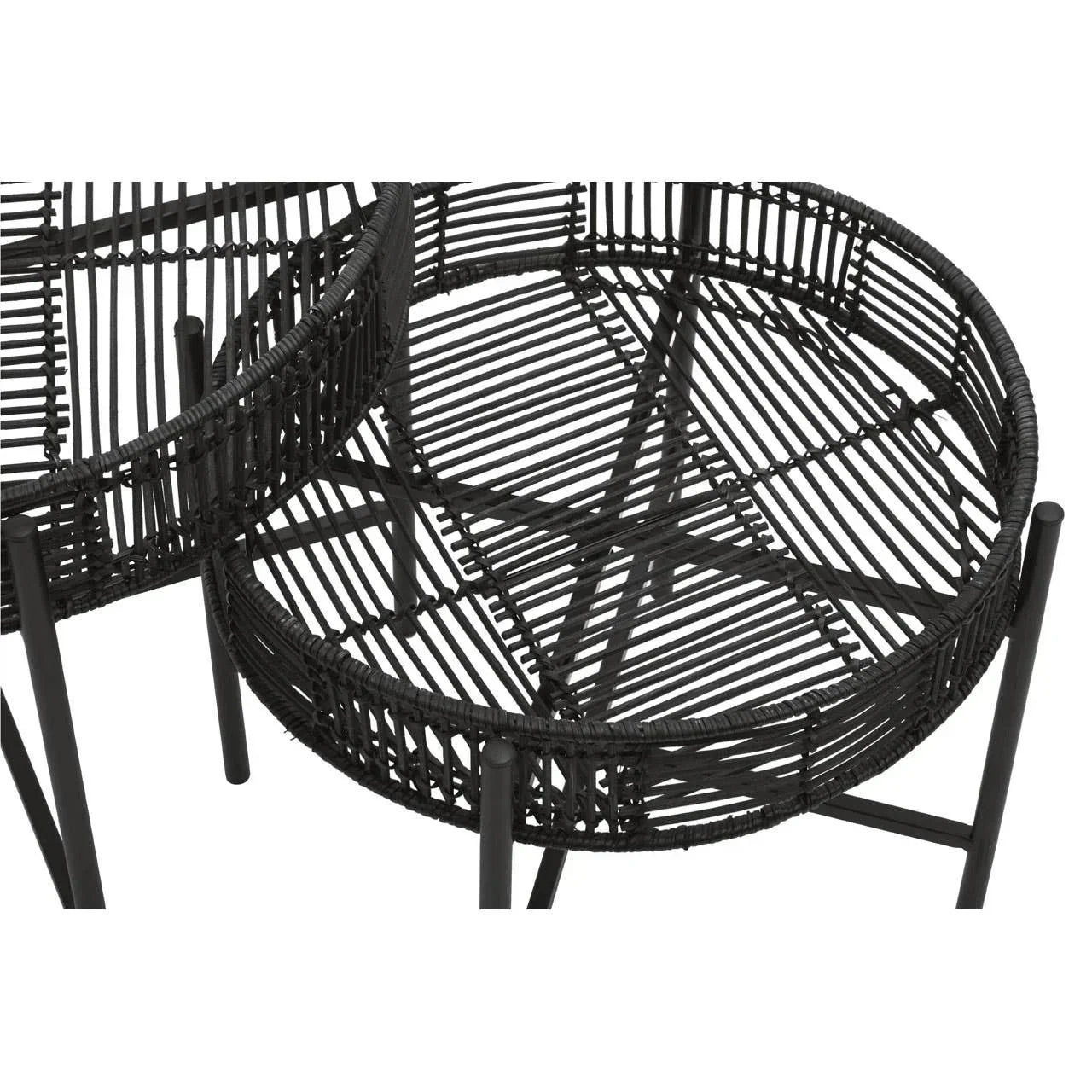Black rattan accent tables with round tops and metal legs, close-up woven detail