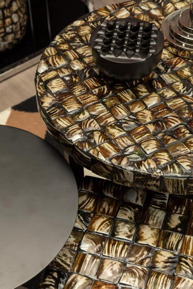Textured mosaic nesting tables with brown and cream tiles, black decorative bowl on top