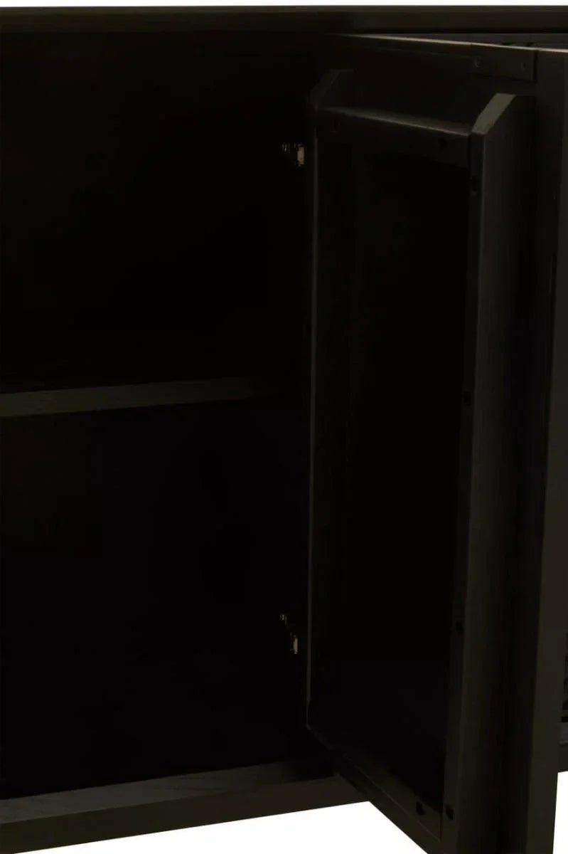 Interior view of black wooden cabinet with open door and shelf