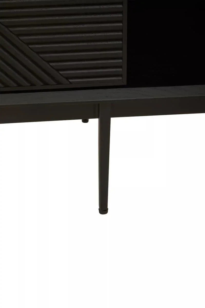 Close view of black wood sideboard leg and textured geometric panel detail