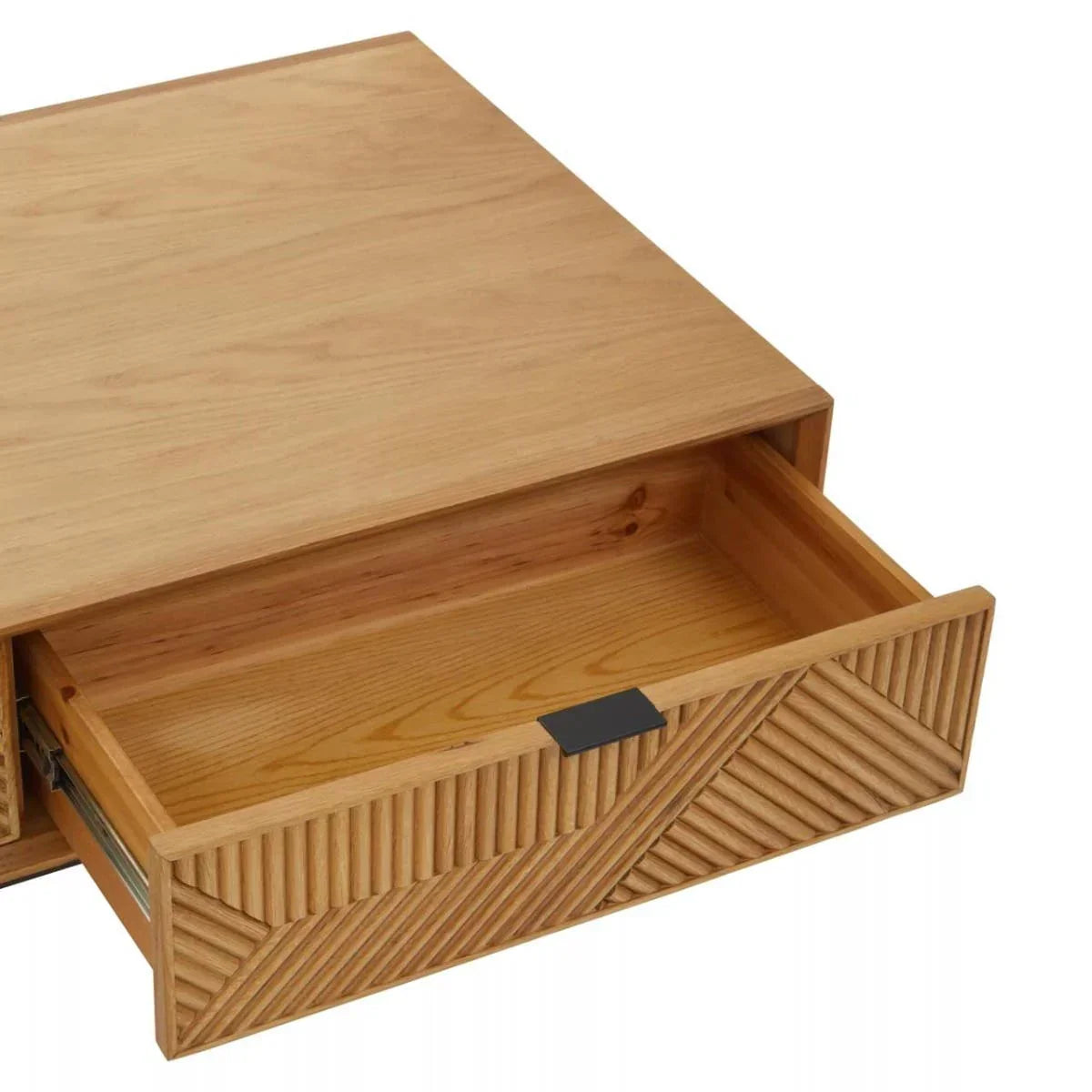 Natural wood drawer unit with geometric carved front and black metal handle, drawer open