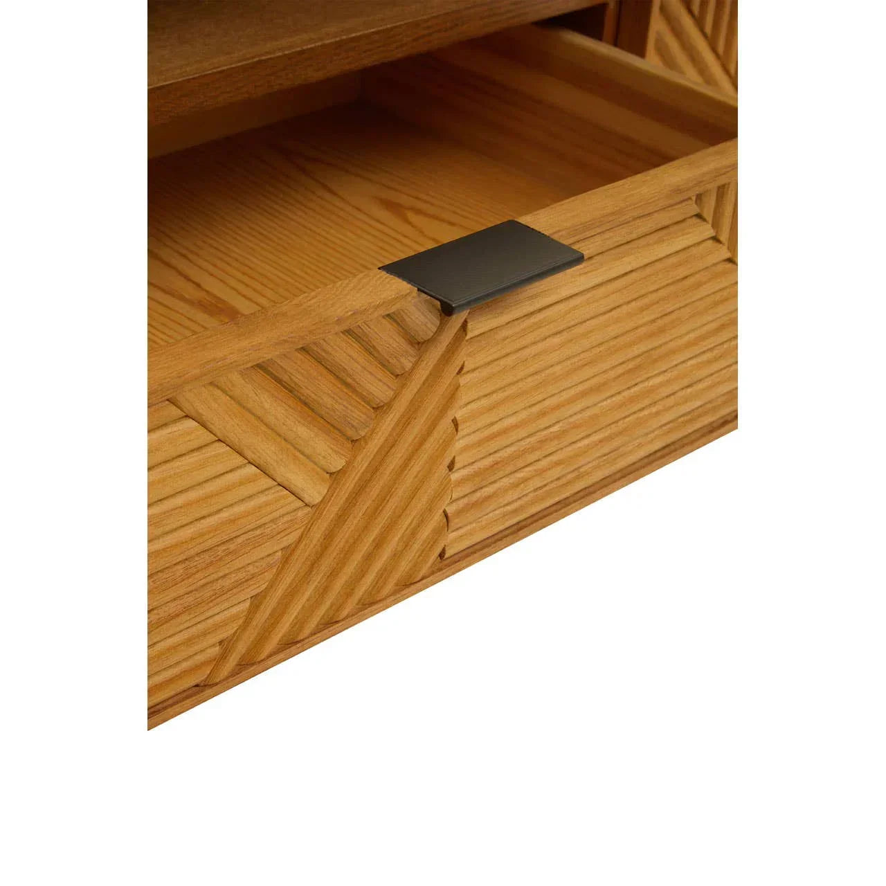 Wooden drawer with textured geometric pattern and black metal handle, close-up view