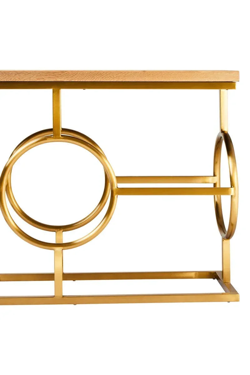 Gold metal console table base with circular accents and wooden tabletop detail