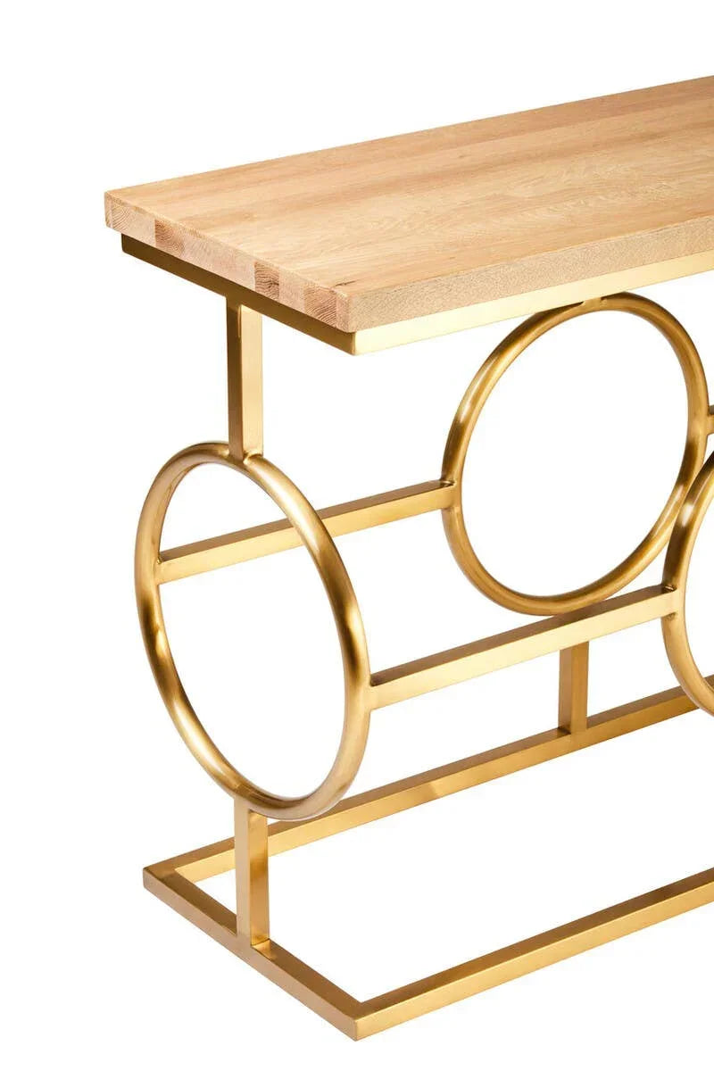 Modern console table with light wood top and gold metal frame featuring circular accents