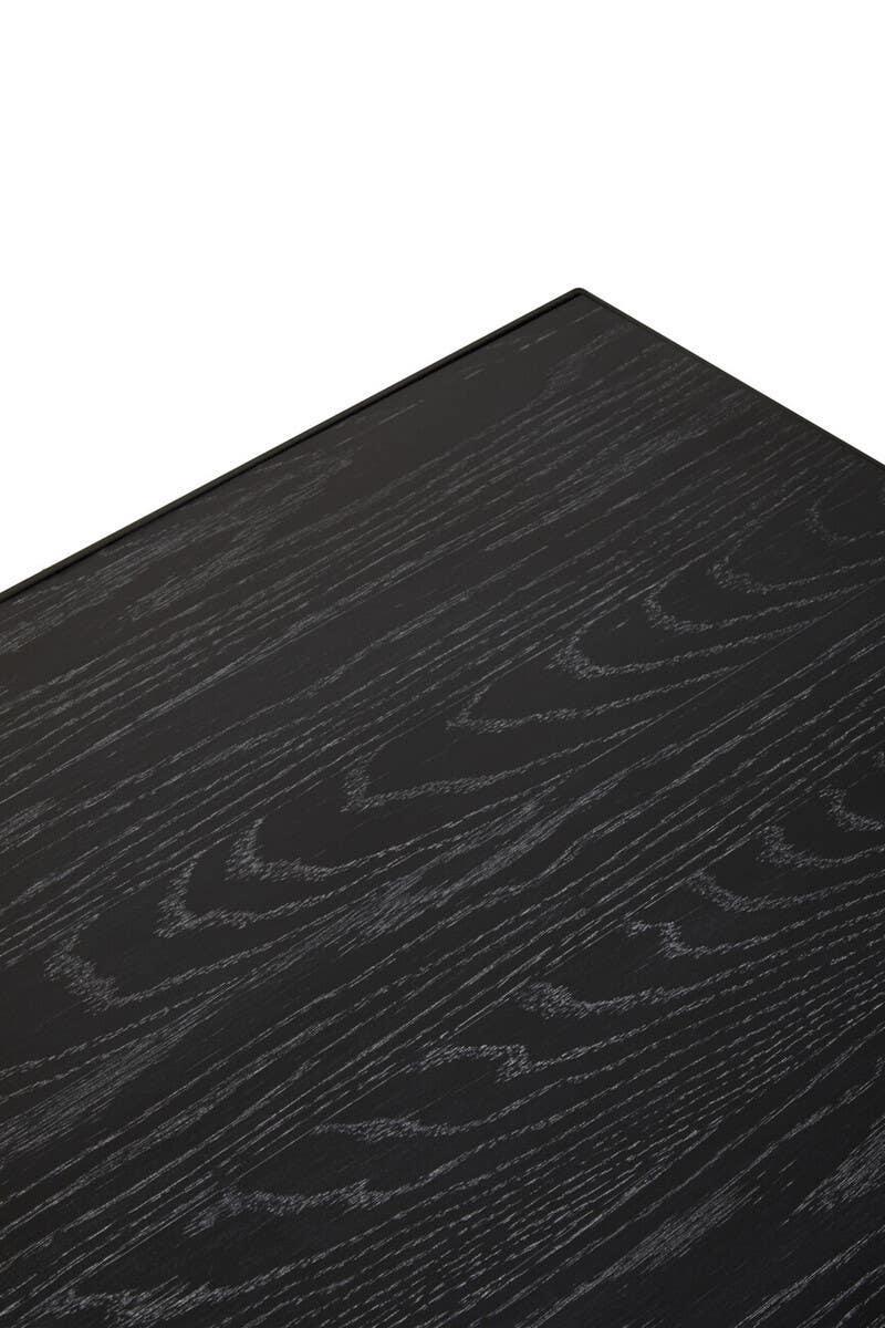Closeup of black wood grain table top with visible textured surface