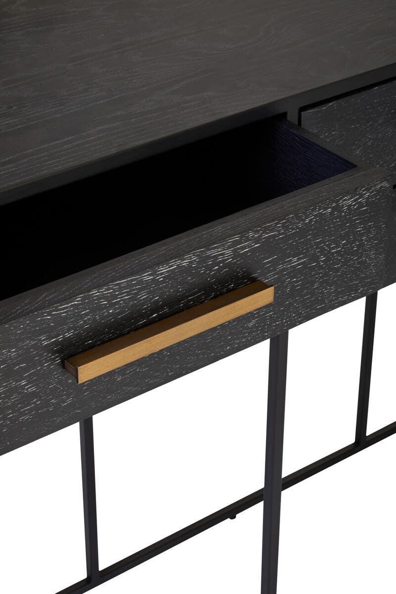 Black wood console table with open drawer and gold handle on metal legs
