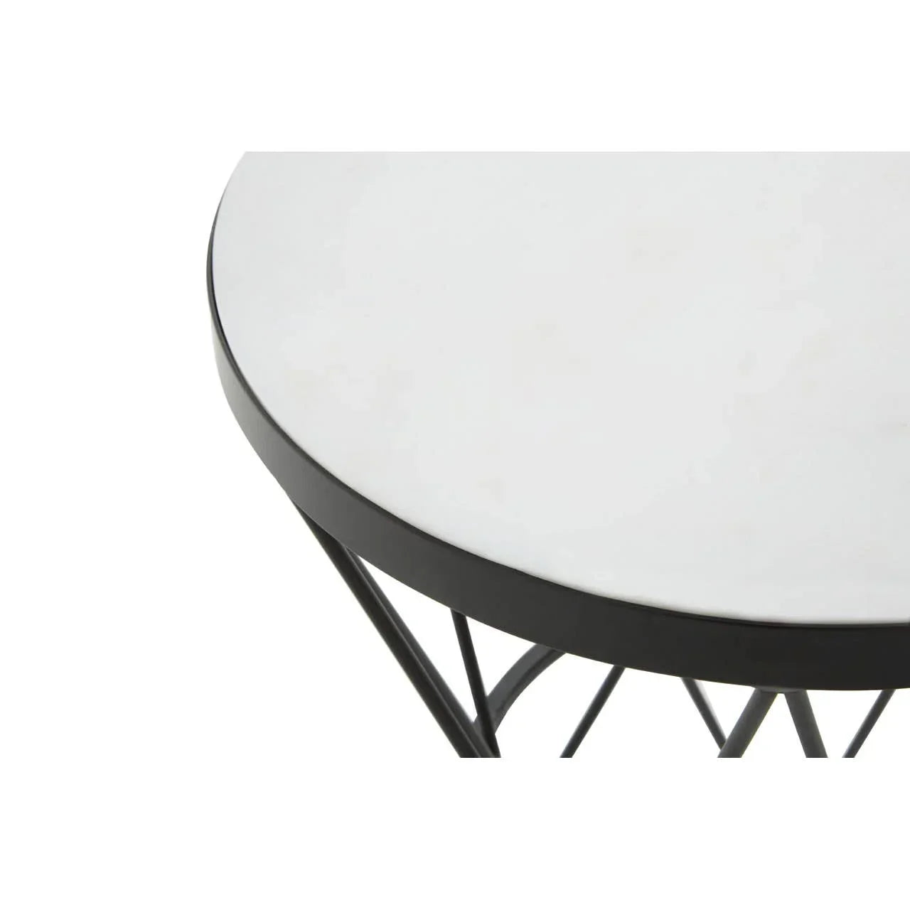 Round side table with white marble top and black metal frame, partial overhead view