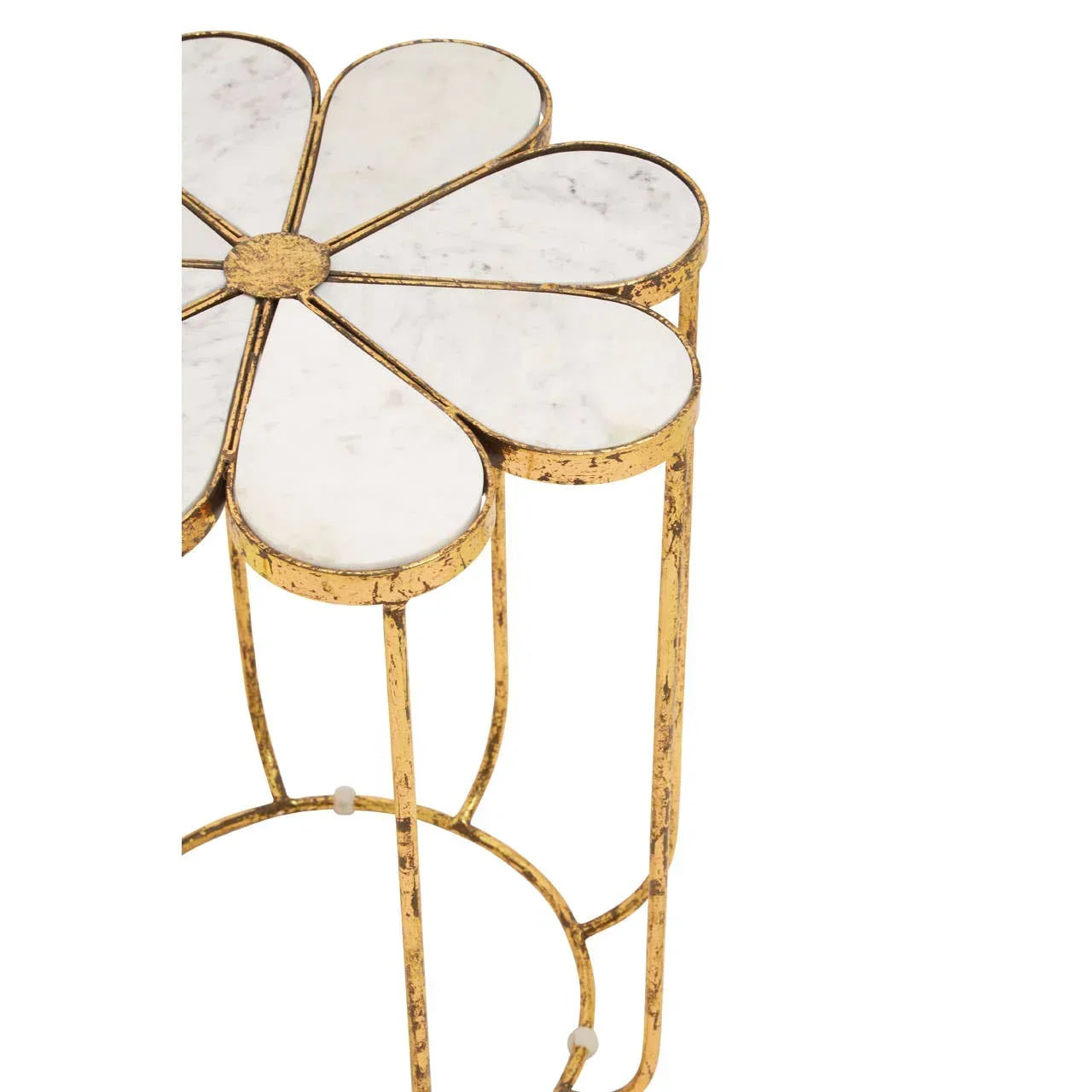 Gold metal side table with white marble flower-shaped top, partial angle view
