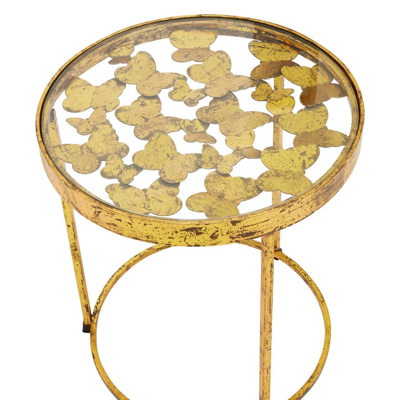 Gold metal side table with glass top featuring butterfly design detail