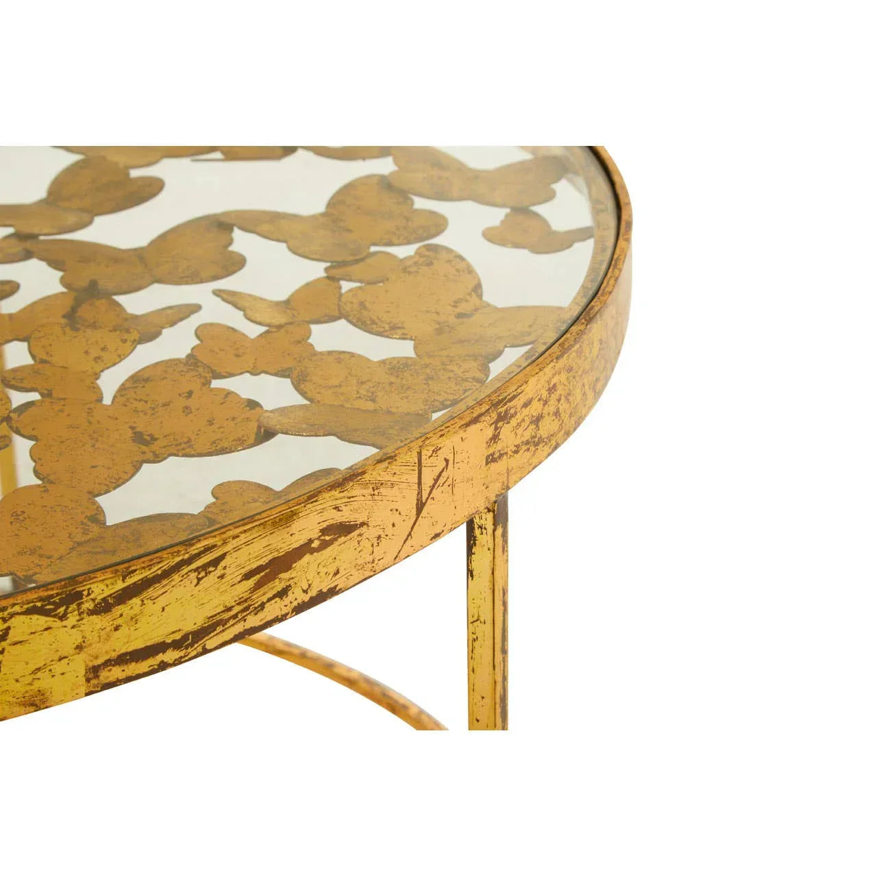 Round gold side table with glass top and decorative leaf pattern