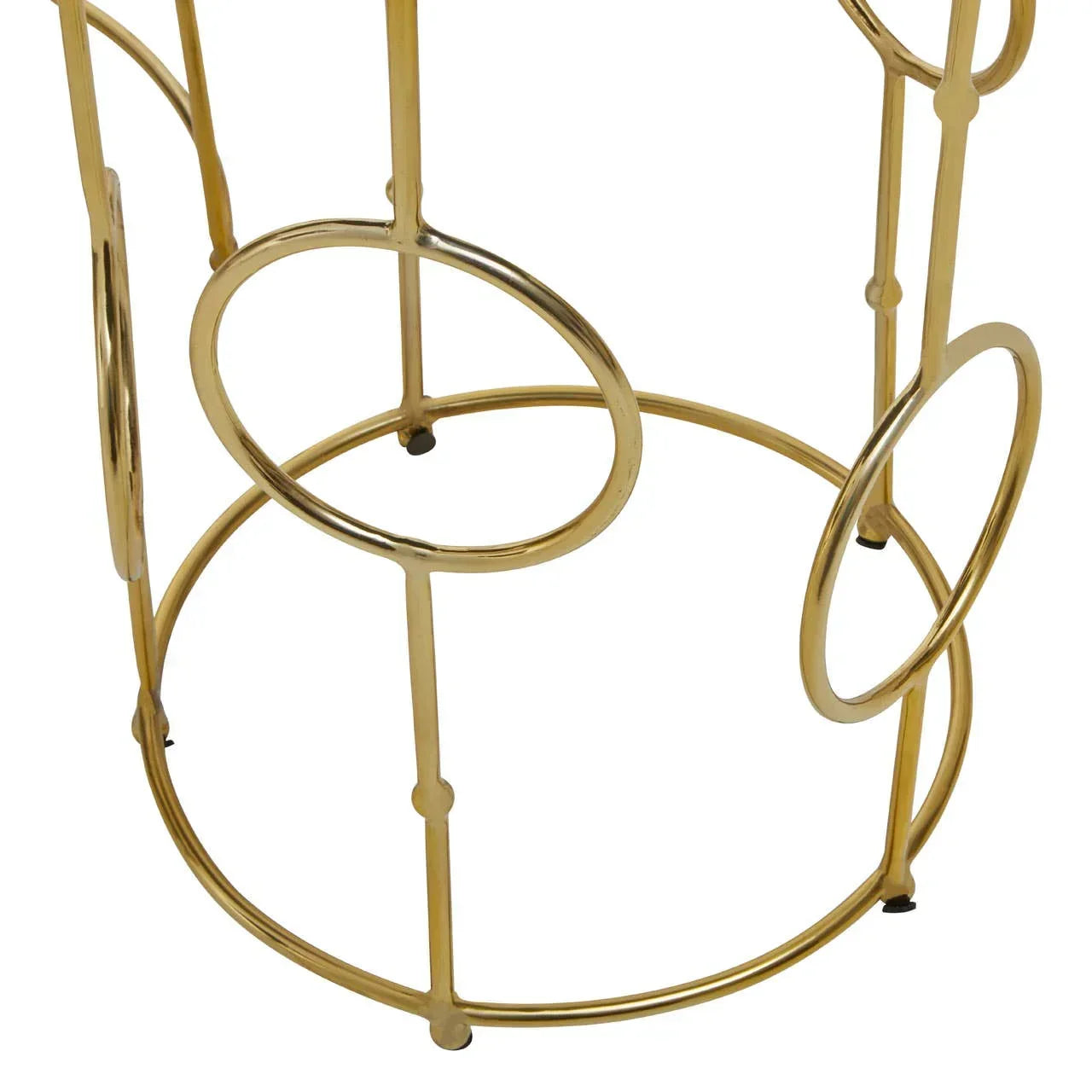 Gold metal side table base with circular ring design detail