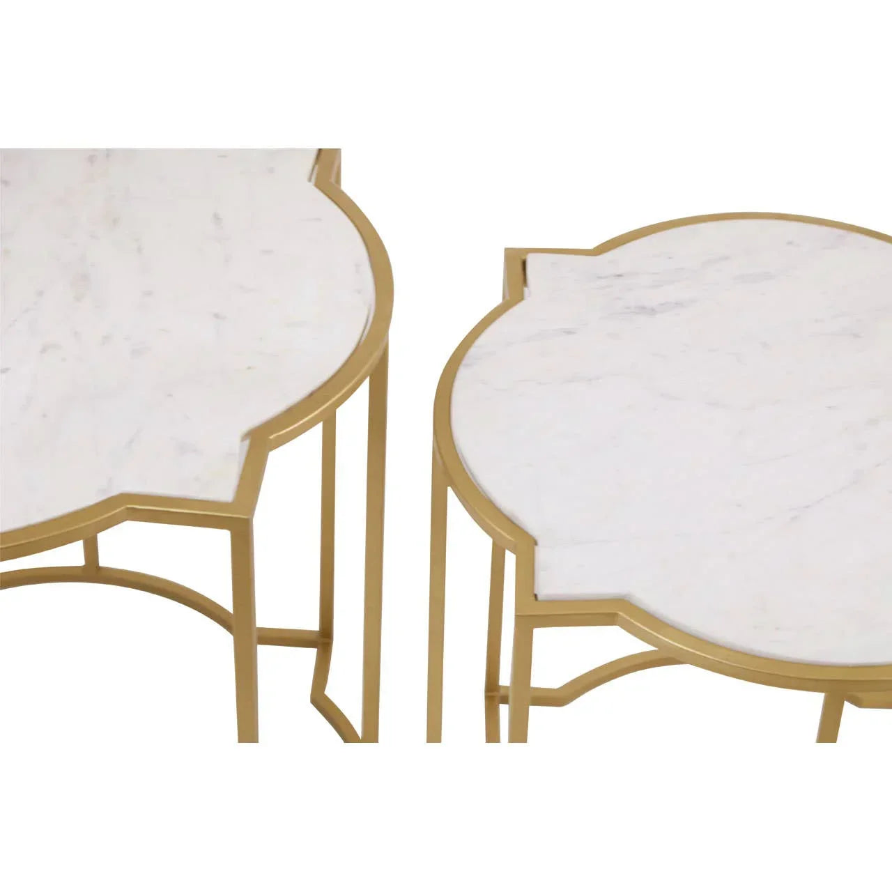 White marble top nesting tables with gold metal frames, close-up view