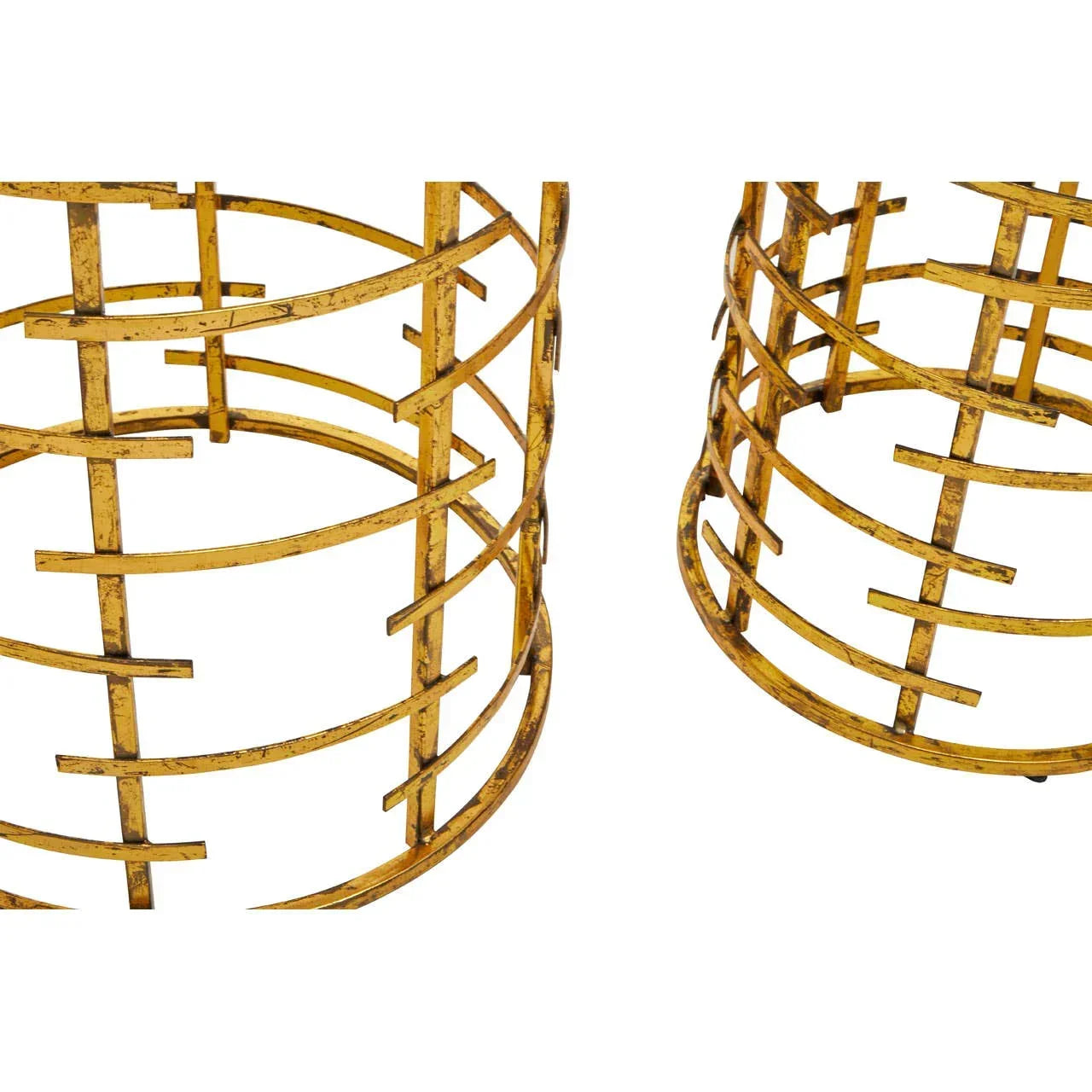 Close-up of gold metal side table bases with geometric lattice design
