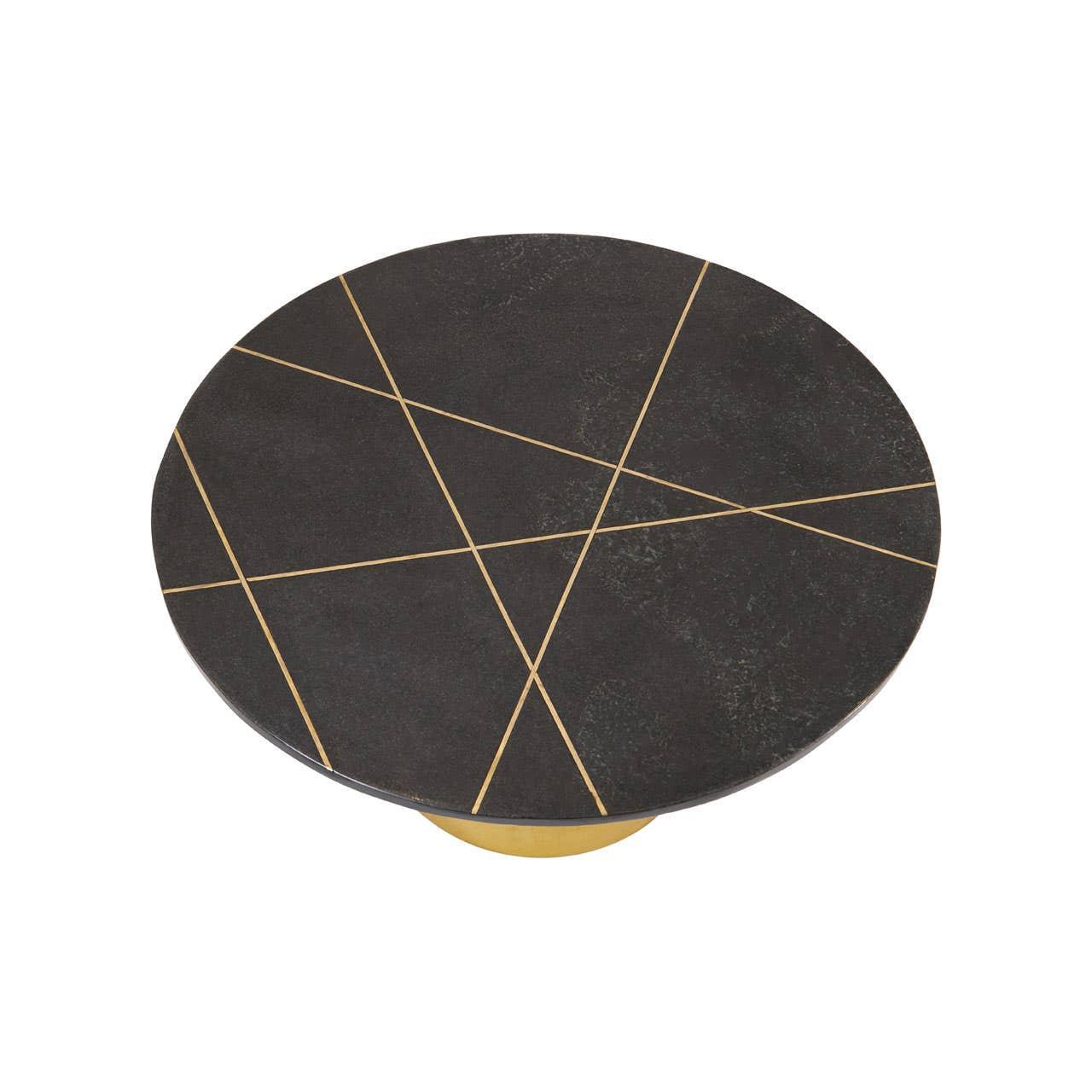 Round coffee table with black top and gold geometric line pattern