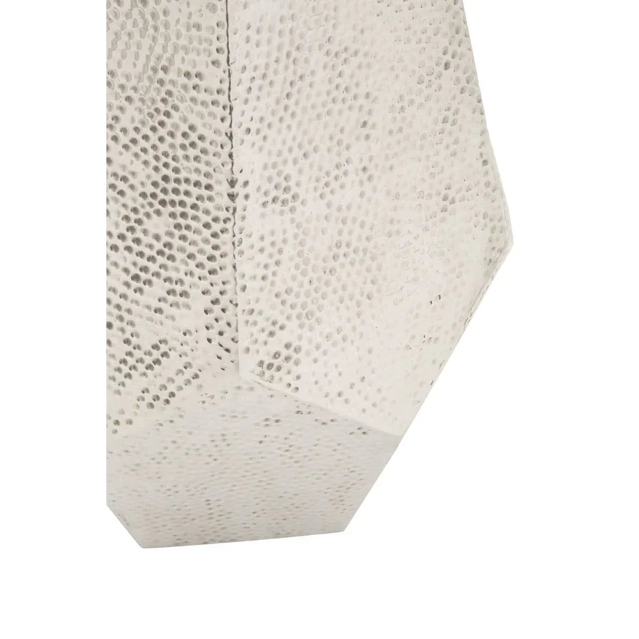 close-up of hammered metal furniture leg with geometric shape and silver finish