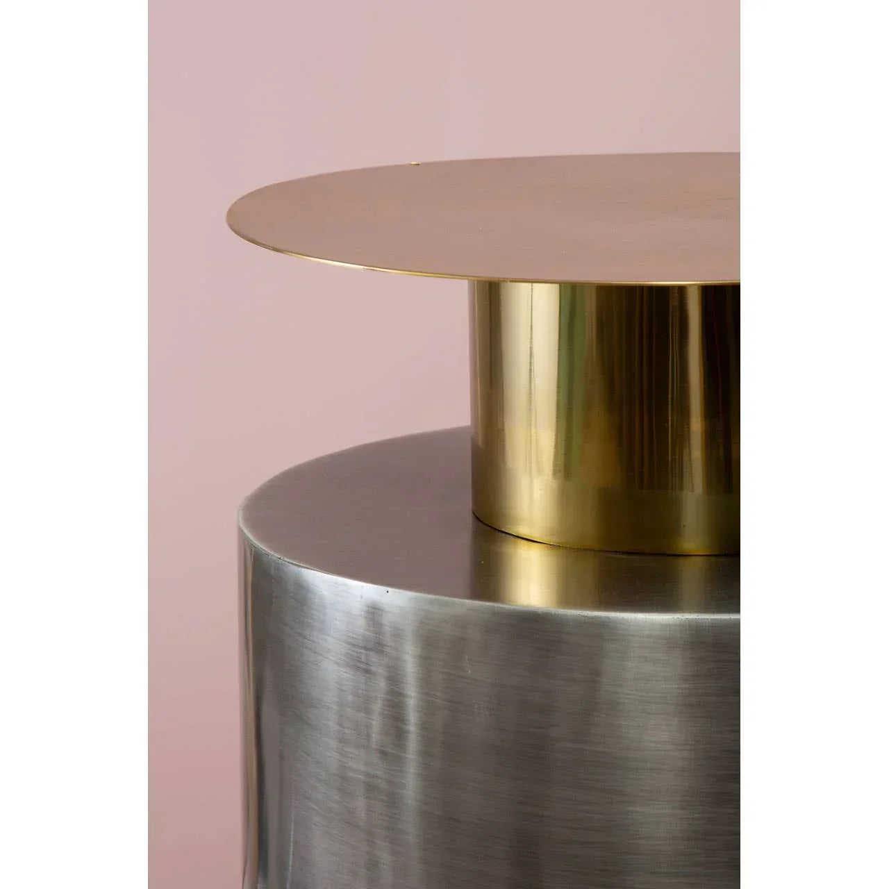 Brushed metal side table with gold accent top, close view showing texture and finish