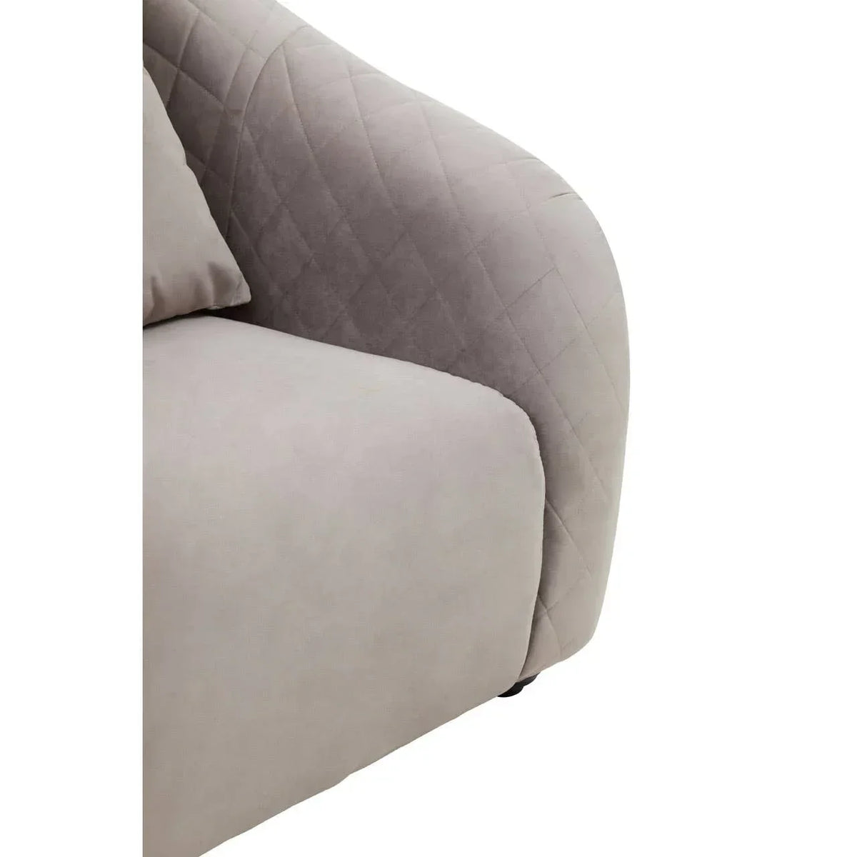 Close-up of light grey fabric sofa armrest with quilted stitching detail