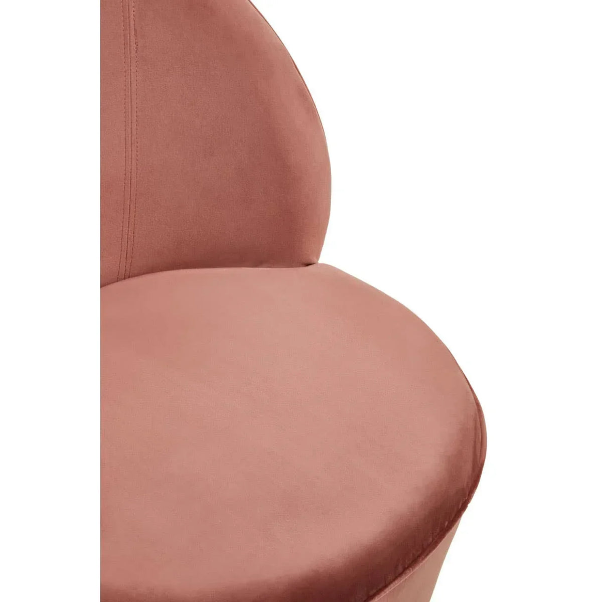 Close-up of blush pink velvet chair seat and curved backrest