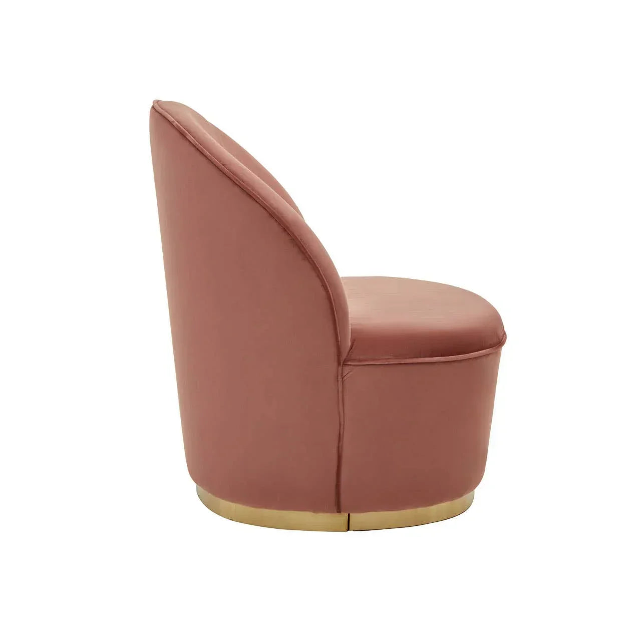Blush pink velvet accent chair with curved backrest and gold base, side view