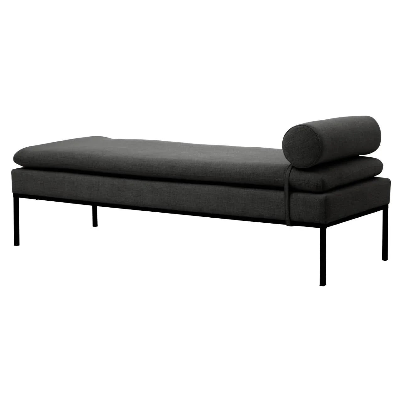 Dark grey fabric daybed with metal frame and cylindrical bolster pillow, side angle view