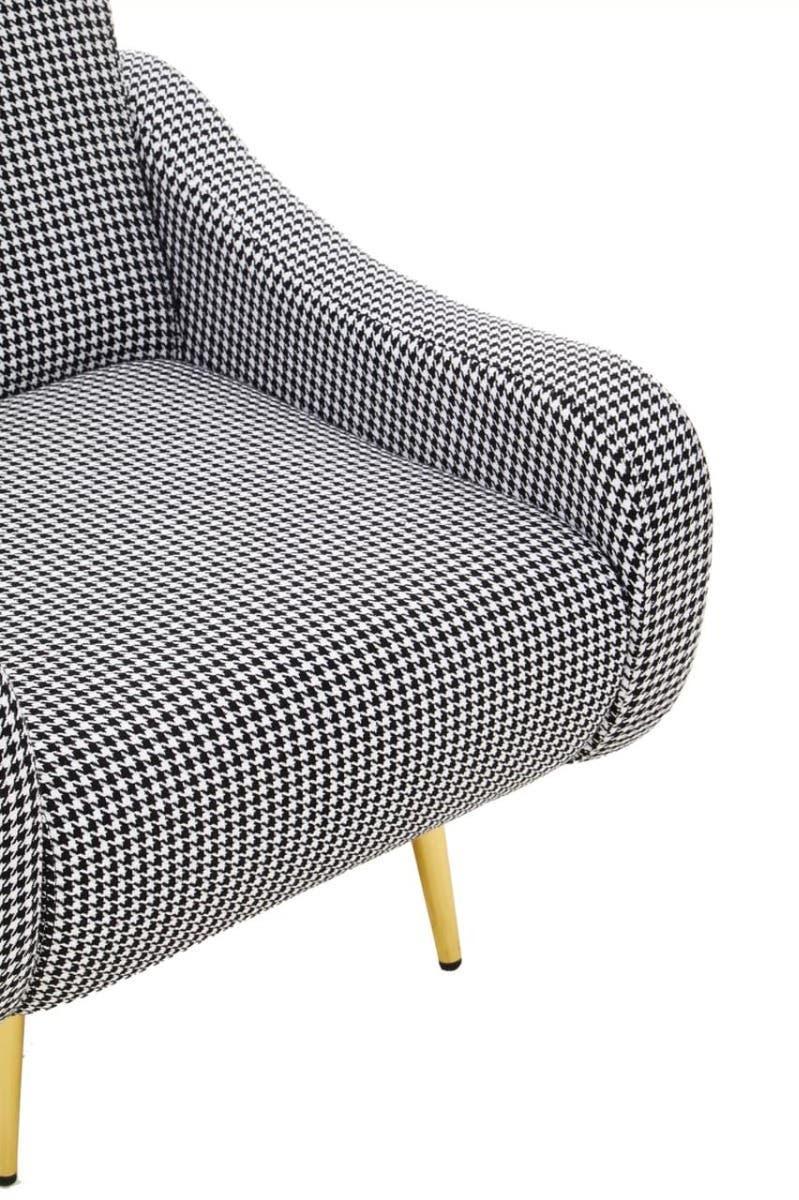 Houndstooth accent chair with yellow wooden legs, close up of padded seat and armrest