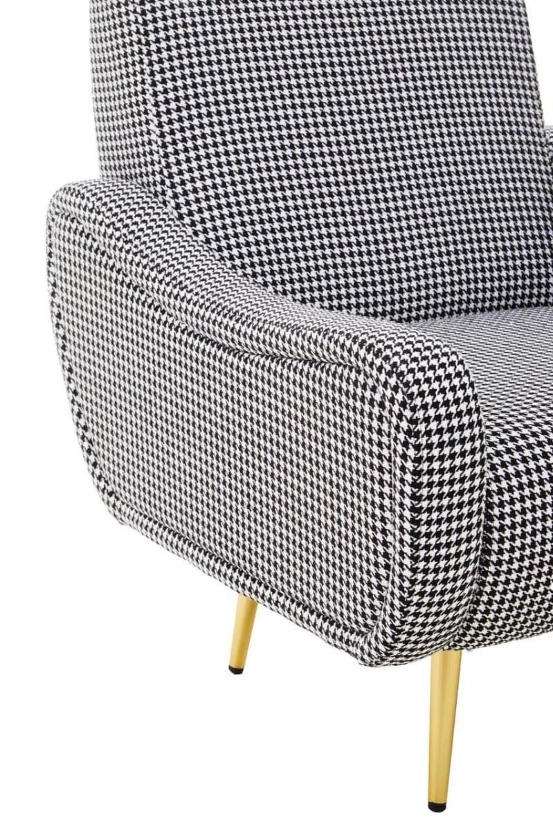 Houndstooth armchair with curved armrest and gold metal legs, close side view