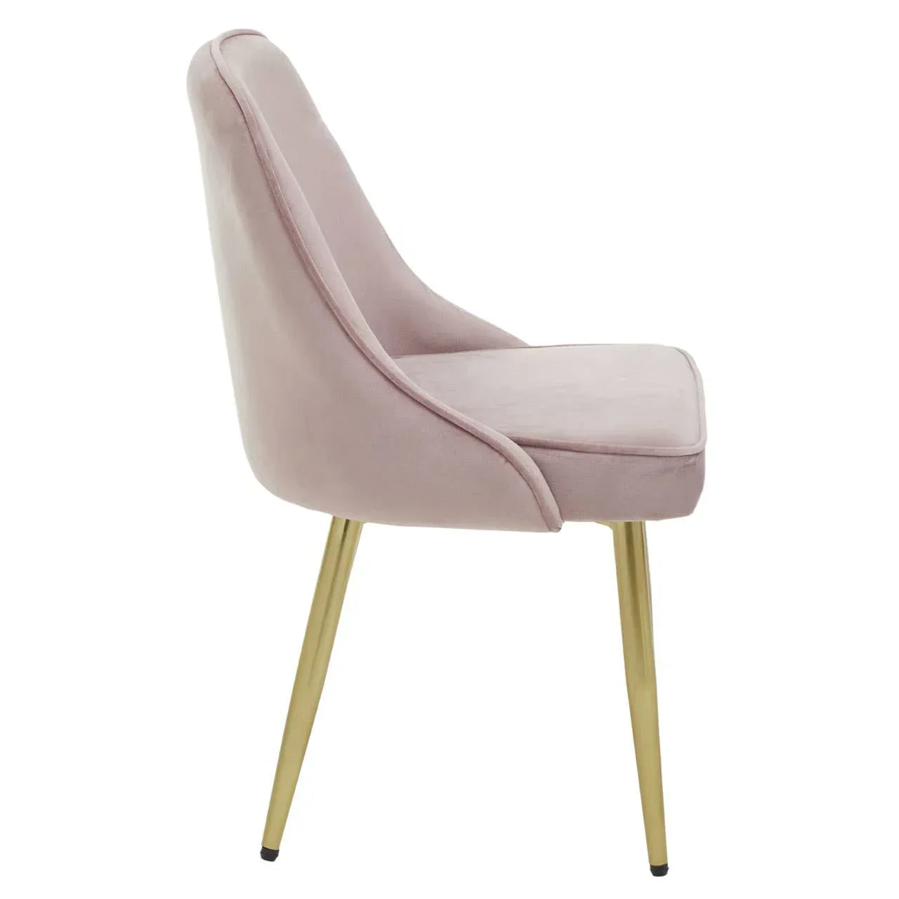 Velvet dining chair in blush pink with gold metal legs, side profile view