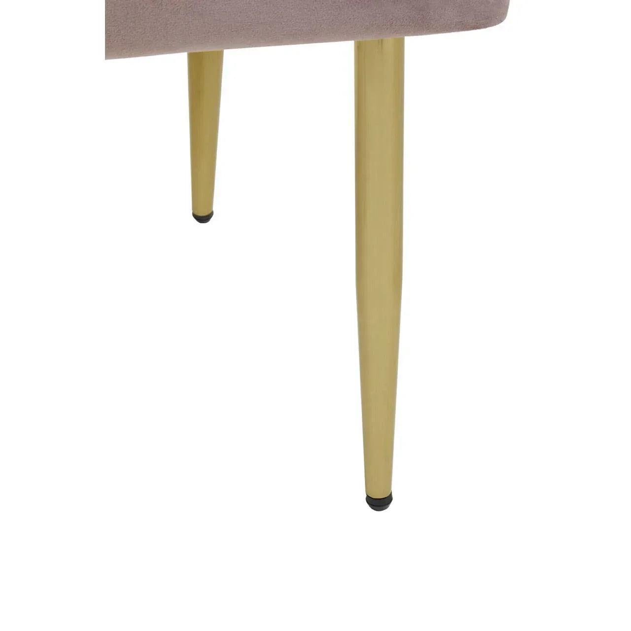 Close view of gold metal chair legs with light mauve upholstered seat