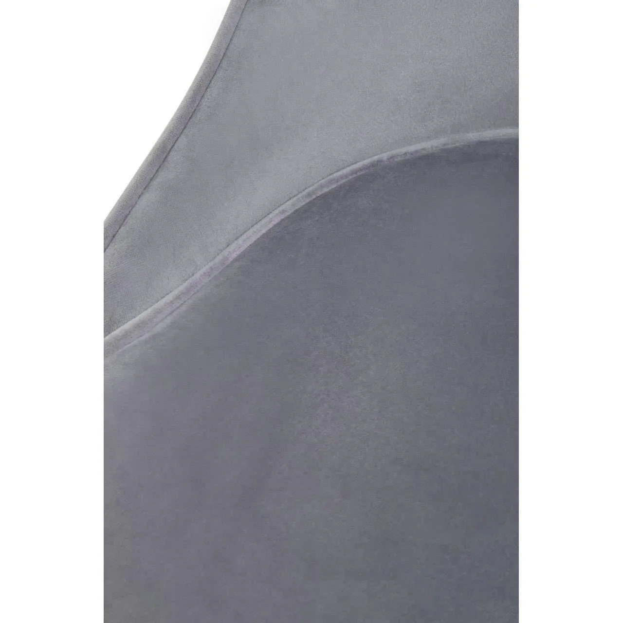 Close-up of grey velvet upholstery on dining chair backrest