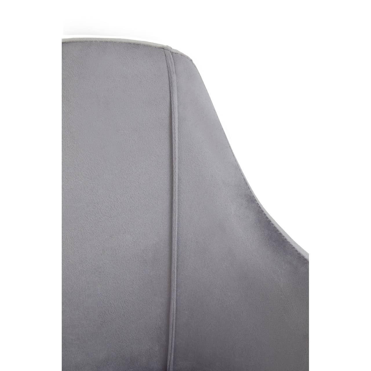Closeup of grey velvet dining chair backrest with stitched seam detail