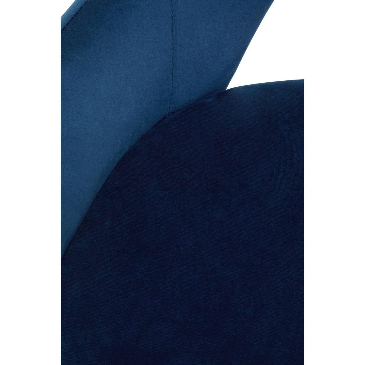 Close-up of blue velvet armchair seat and curved backrest upholstery