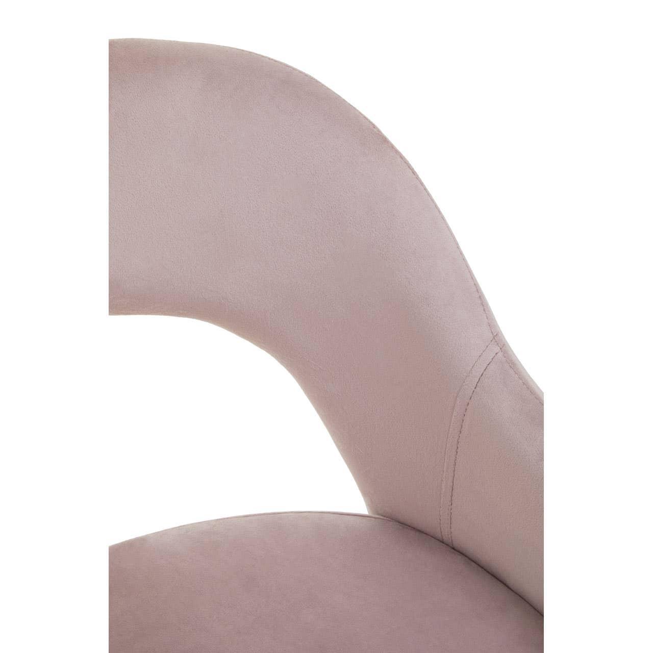 Closeup of pink velvet dining chair backrest and seat upholstery