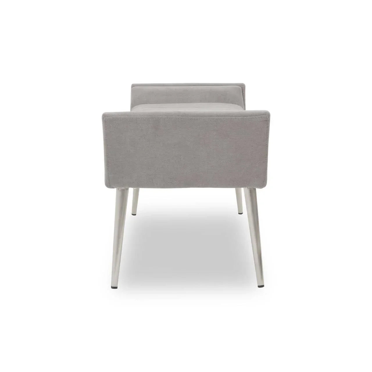 Grey upholstered accent chair with square arms and tapered metal legs, rear view