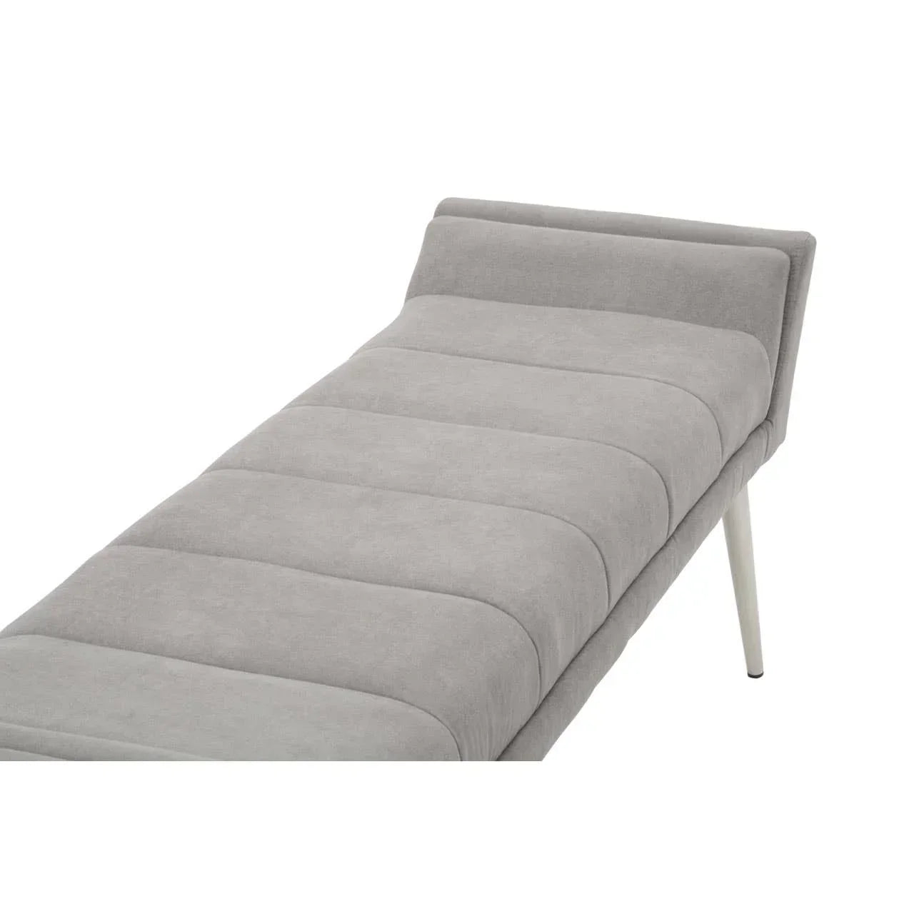 Grey upholstered chaise lounge with tufted seat and angled leg detail