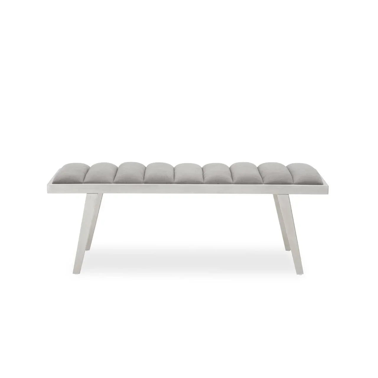 Grey upholstered bench with tufted seat and angled white wooden legs, front view